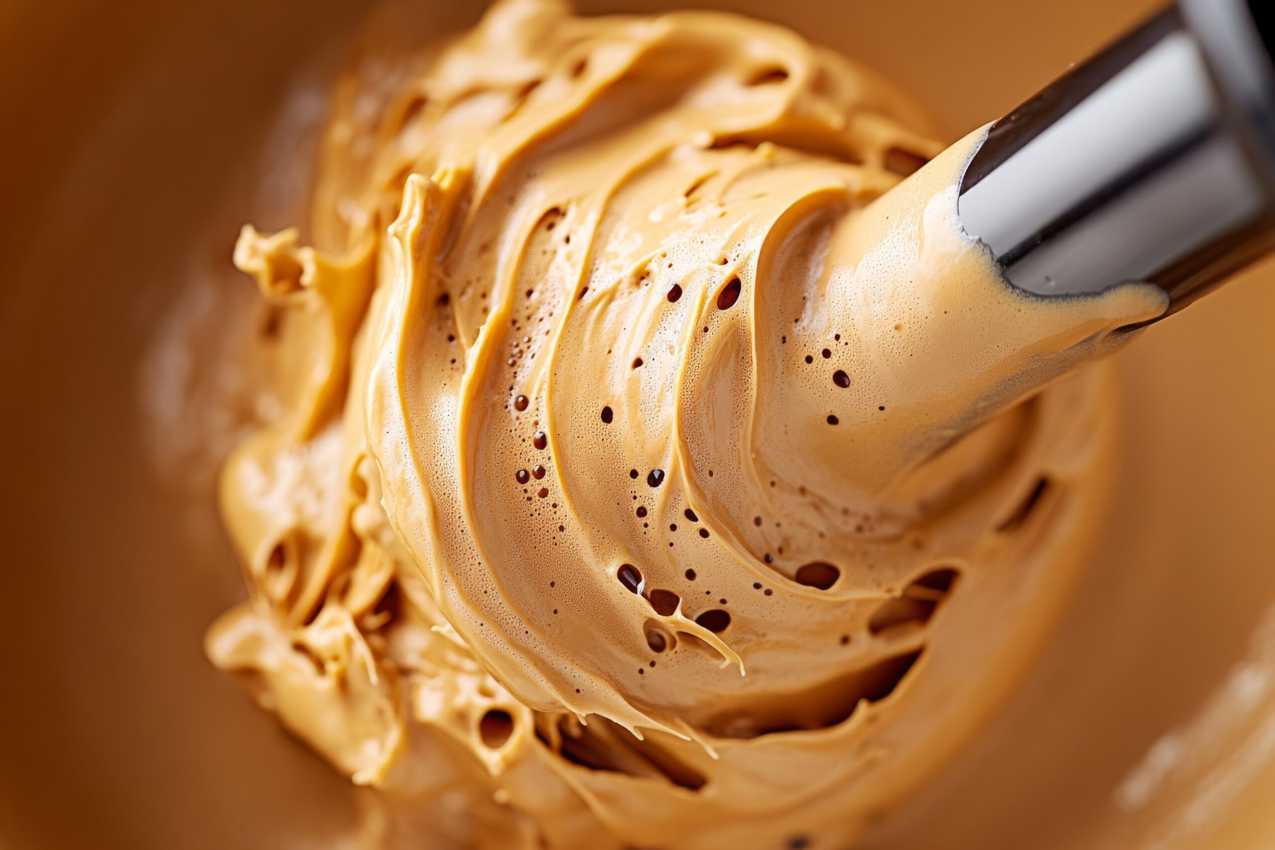 Whipped coffee mixture being prepared in a kitchen with a hand mixer at midday for a delicious beverage experience Swirling coffee crema with rich, golden hues --chaos 20 --ar 3:2 --style raw --profile op2vv8q --stylize 300 --v 6.1 Job ID: e33d1f85-d01d-493d-8b06-4c36031e00ed